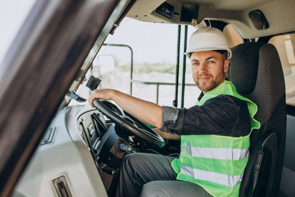 male-worker-with-bulldozer-sand-quarry (webp)